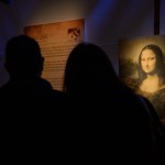 Exhibition guests viewing the Mona Lisa