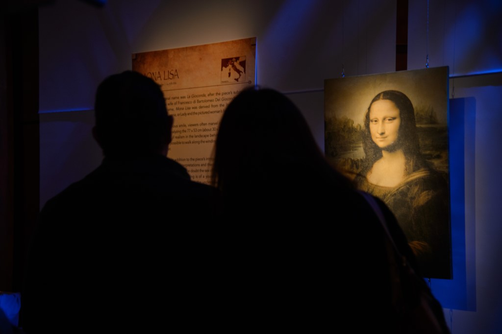 Exhibition guests viewing the Mona Lisa